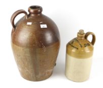 A large early 20th century stoneware flagon and another.