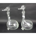 A pair of contemporary blown glass decanters in the forms of ducks.