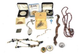 A assortment of costume jewellery and coins.