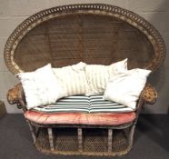A large 20th century wicker peacock chair.