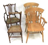 A pair of farmhouse armchairs and three others.