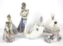 Seven Lladro figures.
