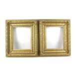 Two ornate gilt wooden picture frames.