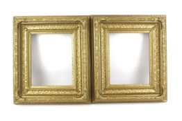 Two ornate gilt wooden picture frames.