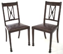 Two mahogany dining chairs.