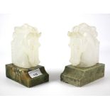 A pair of early 20th century carved onyx horse head book ends.