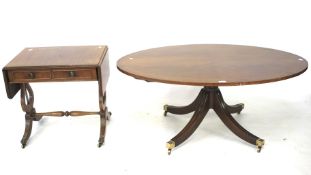 A mahogany oval coffee table and a sofa table.