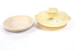 A Poole Pottery bowl and a Clarice Cliff Art Deco tureen.
