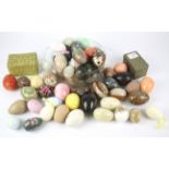 A large collection of stone and other collectable eggs.