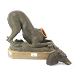 A mid century terracotta model of a greyhound.