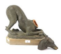 A mid century terracotta model of a greyhound.