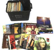 A large collection of vinyl records and albums.