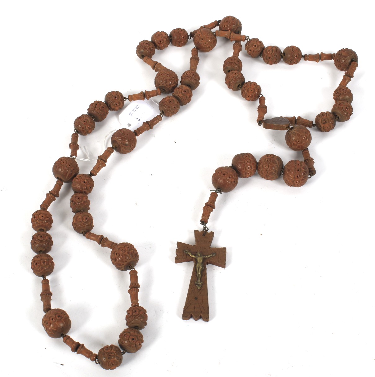 An early 20th century French carved wooden rosary bead necklace.