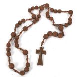 An early 20th century French carved wooden rosary bead necklace.