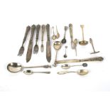 A collection of Georgian and later English and Scottish silver and white metal flatware.