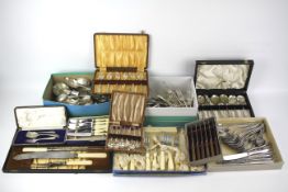 A quantity of silver plate and metal flatware.