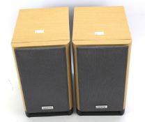 Two Onkyo speakers. In wood effect casing, model D-N9BX.