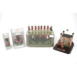 A collection of lead commemorative figures.