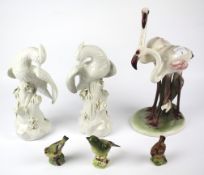 A collection of ceramics figures of birds.