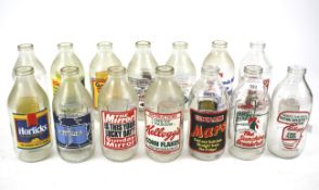 A collection of advertising milk bottles.