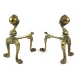 A pair of brass claw and ball fire dogs.