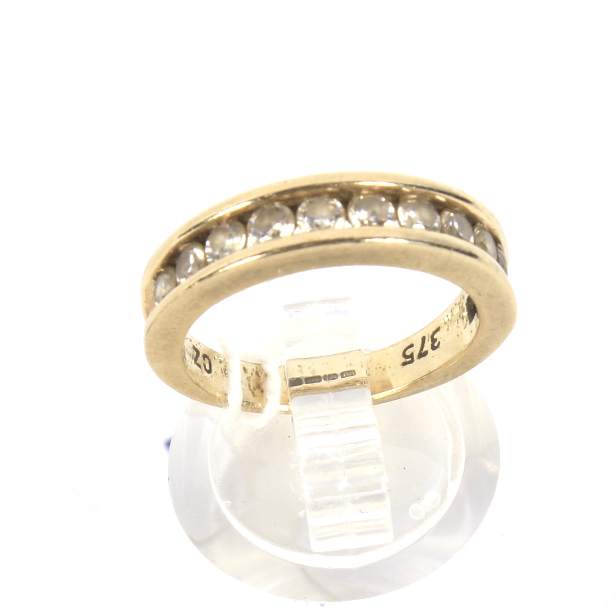 A 9ct gold and cubic zirconia half eternity ring. Size M/N, 4.