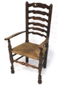 An early 20th century ladderback armchair.