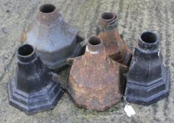 Five assorted cast iron drainpipe hoppers.