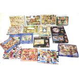 A collection of assorted jigsaw puzzles.