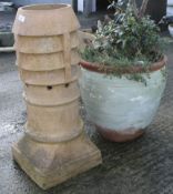 A large plant pot and a chimney pot.