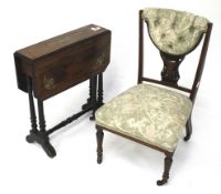 A turn of the century rosewood child's chair and Sutherland style table.
