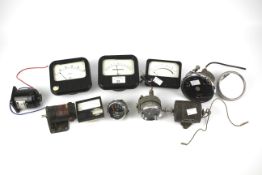 An assortment of motoring accessories . Including Smiths clocks, American aircraft gauges, etc.