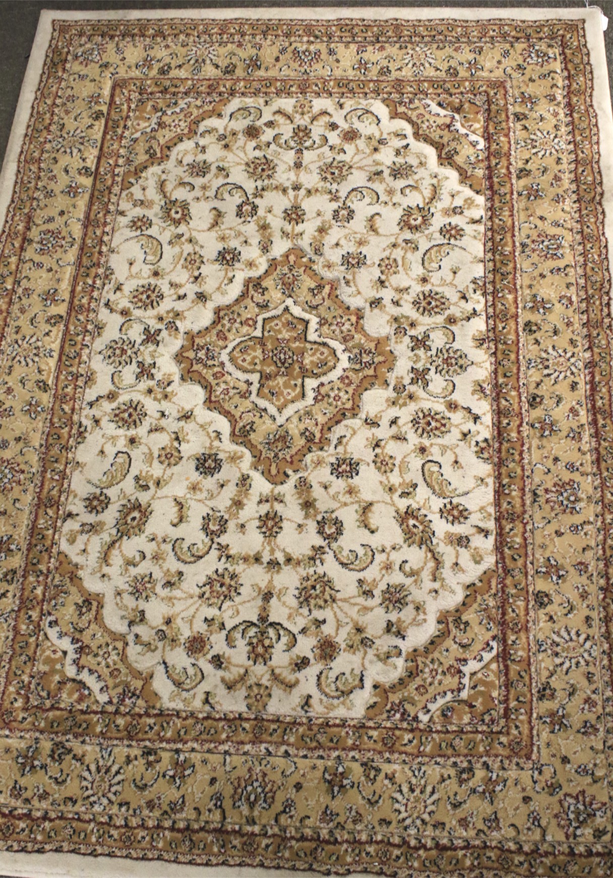 A contemporary cream floor rug.