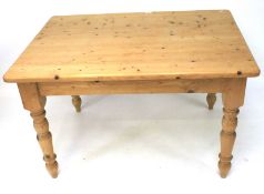 A 20th century pine dining table. Of rectangular form.