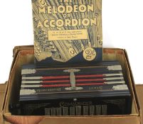 An early 20th century Art Deco Commander accordion.