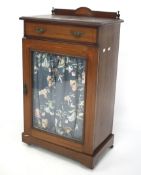 An Edwardian mahogany inlaid musical cabinet.