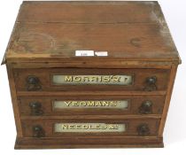 An early 20th century table top three drawer haberdashery cabinet.