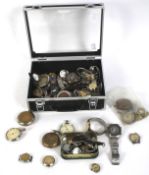A collection of wrist watches and components.