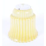 A retro yellow glass pendant lamp shade.