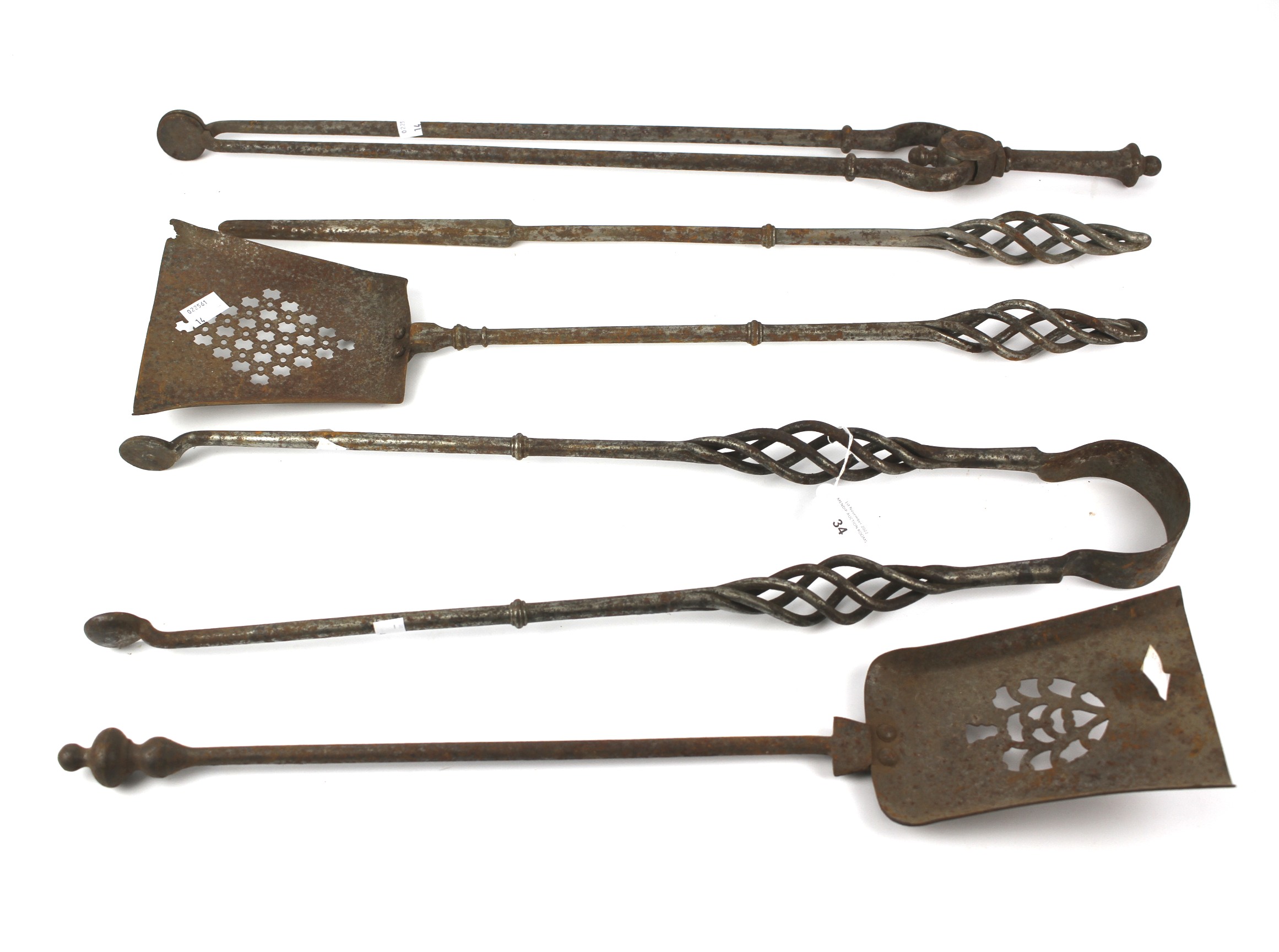 A collection of 19th century steel fireside irons.