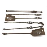 A collection of 19th century steel fireside irons.
