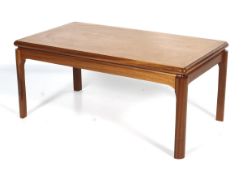 A Nathan rectangular teak coffee table. With rounded edges and supports, L93cm x D52.