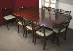 A twin pedestal mahogany dining table and set of nine chairs.