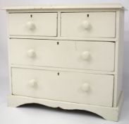 An early 20th century white painted pine chest of drawers.