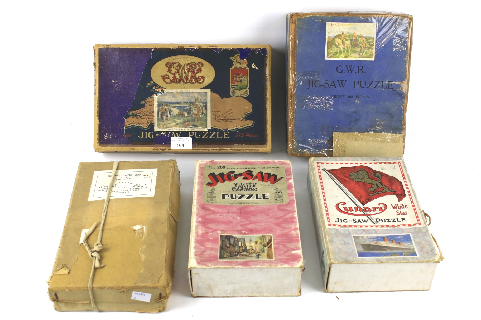 Five early wooden jigsaw puzzles.