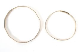 Two vintage ladies 9ct gold plated bangles. Both with metal core and engraved decoration, 12.