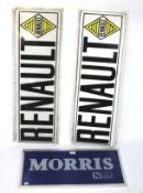 A blue 'Morris' sign, and two plastic profiled 'Renault' signs.