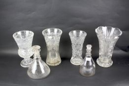 A collection of cut glass vases and decanters.