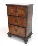 A 19th century inlaid chest of drawers.