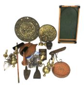 An assortment of brassware and other metal ware.